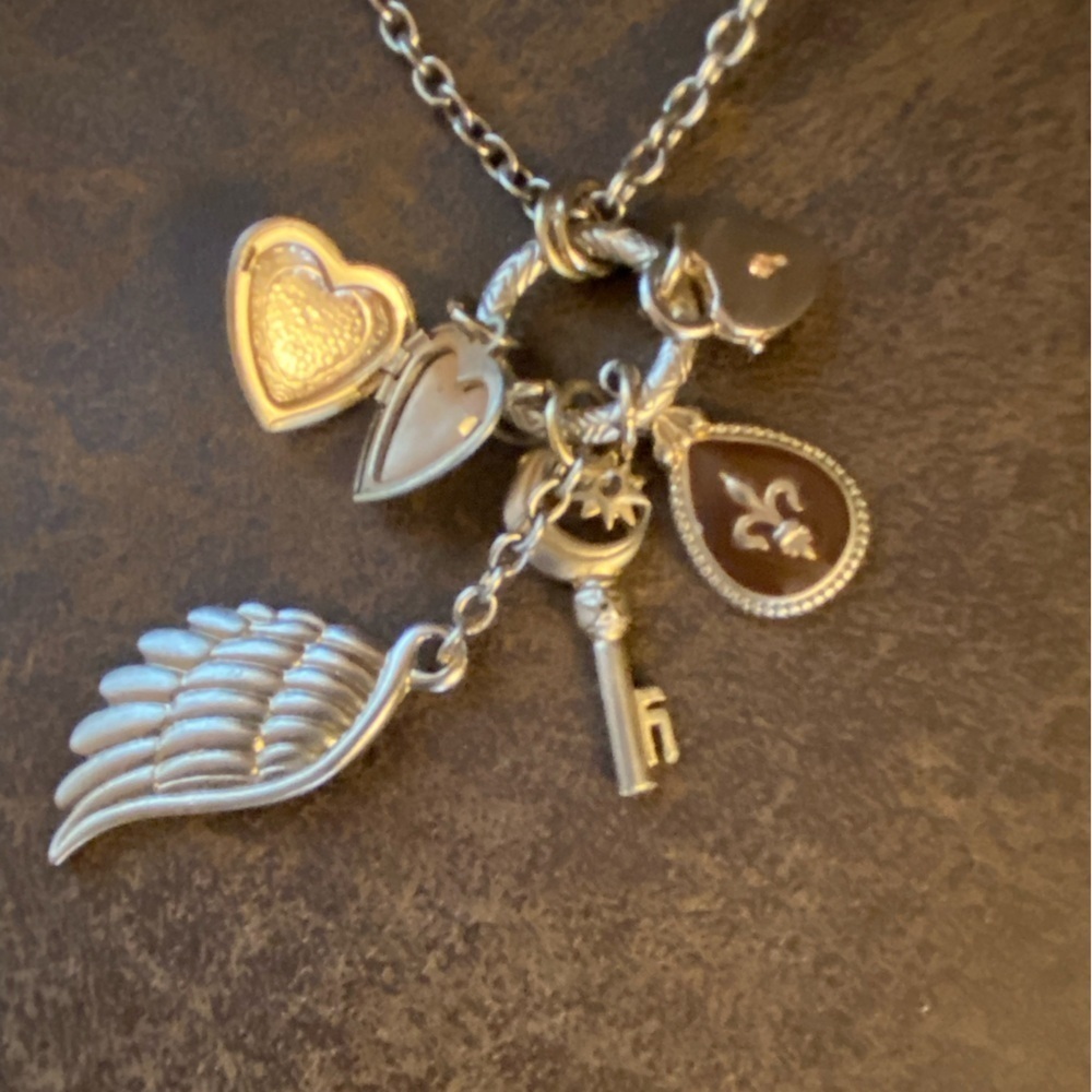 Signed VCLM silver toned necklace Locket heart fleur de lis lock wing charms